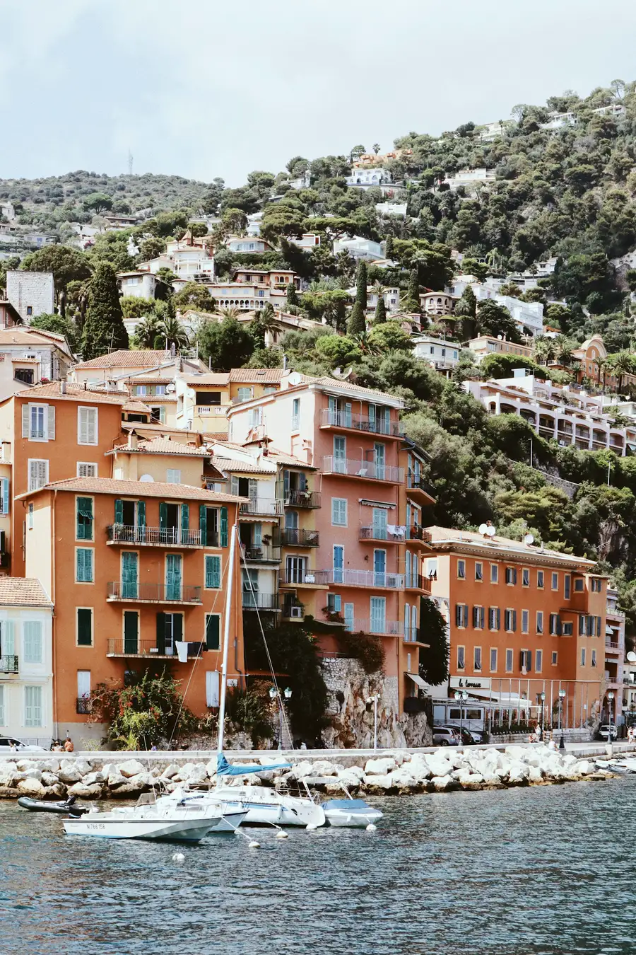 Ochre and terracotta façades rising above the harbour at Villefranche-sur-Mer.