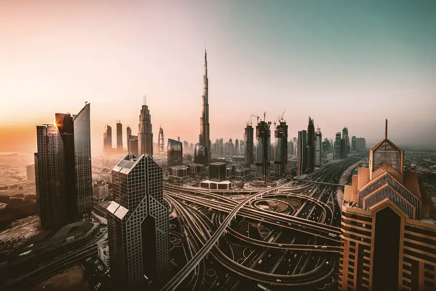 The Dubai skyline and Burj Khalifa in the haze of early evening.